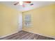 Bright bedroom with sleek floors, a ceiling fan and a window at 22 Cardinal Ln, Jonesboro, GA 30238
