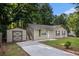 This lovely house has a shed with room for parking on a concrete driveway at 22 Cardinal Ln, Jonesboro, GA 30238
