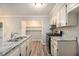 Well-equipped kitchen with granite counters and stainless steel oven, ready for cooking at 22 Cardinal Ln, Jonesboro, GA 30238