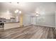 Bright open-concept living space with modern floors and seamless flow to the kitchen at 22 Cardinal Ln, Jonesboro, GA 30238