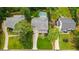 Aerial view showcases home's layout with a pool and landscaped backyard at 4048 Navajo Trl, Brookhaven, GA 30319