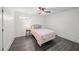 Cozy bedroom with a ceiling fan, vinyl floors, and a large window for natural light at 4048 Navajo Trl, Brookhaven, GA 30319