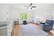 Bright bedroom with a crib, blue accents, and large windows overlooking the yard at 4048 Navajo Trl, Brookhaven, GA 30319