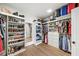 Walk-in closet with custom shelving and storage for clothing, shoes, and accessories at 4048 Navajo Trl, Brookhaven, GA 30319