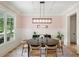 Dining room boasts elegant lighting and sophisticated decor at 4048 Navajo Trl, Brookhaven, GA 30319