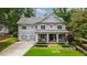 Charming two-story home with a manicured front yard and a two-car garage at 4048 Navajo Trl, Brookhaven, GA 30319