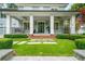 Inviting front porch features stone walkway, swing, and manicured landscaping at 4048 Navajo Trl, Brookhaven, GA 30319