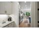 Open concept kitchen with white cabinets, granite countertops, and stainless steel appliances, ideal for cooking at 4048 Navajo Trl, Brookhaven, GA 30319