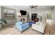 Inviting living room with stone fireplace, ceiling fan, hardwood floors, and comfortable seating at 4048 Navajo Trl, Brookhaven, GA 30319