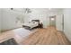 Bright main bedroom features hardwood floors, ceiling fan and an ensuite bathroom with a large window view at 4048 Navajo Trl, Brookhaven, GA 30319
