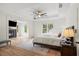 Comfortable main bedroom with tray ceiling, fireplace, and large windows for natural light, creating a cozy retreat at 4048 Navajo Trl, Brookhaven, GA 30319