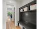 Organized mudroom with built-in storage, bench, and hooks to efficiently manage entryway clutter at 4048 Navajo Trl, Brookhaven, GA 30319