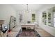 Bright office space with multiple windows, a modern chandelier, and a colorful rug at 4048 Navajo Trl, Brookhaven, GA 30319