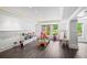 Bright and airy playroom featuring recessed lighting, decorative molding, hardwood floors, and an abundance of toys at 4048 Navajo Trl, Brookhaven, GA 30319
