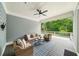 Covered porch with outdoor seating and ceiling fan at 4048 Navajo Trl, Brookhaven, GA 30319