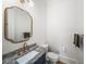 Stylish powder room with custom mirror, unique vanity, and modern fixtures for a touch of elegance at 4048 Navajo Trl, Brookhaven, GA 30319