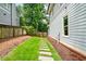 Side yard with stepping stone pathway and manicured lawn at 4048 Navajo Trl, Brookhaven, GA 30319