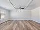 Bright bedroom with ceiling fan, tray ceiling and large windows offering plenty of natural light at 4437 Hosch Reserve Ct, Buford, GA 30519