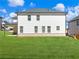 Two-story home has a flat backyard, with ample windows providing views and natural light at 4437 Hosch Reserve Ct, Buford, GA 30519