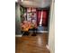 Cozy Central Perk themed nook in the basement with warm lighting and unique decor, and wood flooring at 17 Country Walk, Cartersville, GA 30121