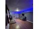 Finished basement with wood laminate flooring, and neutral walls providing a versatile space for recreation or relaxation at 17 Country Walk, Cartersville, GA 30121