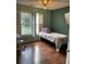 The bedroom has hardwood floors, a shuttered window, and a desk at 17 Country Walk, Cartersville, GA 30121