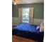 This cozy bedroom features hardwood floors and a shuttered window at 17 Country Walk, Cartersville, GA 30121