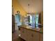 Well-lit kitchen and dining area with tiled floors, white cabinets, and natural light at 17 Country Walk, Cartersville, GA 30121