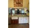 An open-concept kitchen featuring a farmhouse sink and seamlessly connecting with the living room at 17 Country Walk, Cartersville, GA 30121
