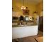 Spacious kitchen with ample counter space, stainless steel appliances, and a view into the living room at 17 Country Walk, Cartersville, GA 30121