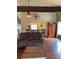 Cozy living room has a ceiling fan, view into kitchen bar, hardwood floors and comfortable furnishings at 17 Country Walk, Cartersville, GA 30121