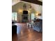 Bright living room featuring a stone fireplace, hardwood floors, ceiling fan, and comfortable seating at 17 Country Walk, Cartersville, GA 30121