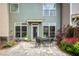 Landscaped backyard with outdoor patio, plants and shrubs and an outdoor living space at 239 S Village Sq, Canton, GA 30115