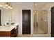 This bathroom features a glass shower, a dark door, and a light-colored vanity at 239 S Village Sq, Canton, GA 30115