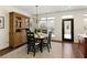 Charming dining area featuring a wooden hutch and natural light at 239 S Village Sq, Canton, GA 30115