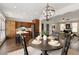 Open-concept dining area next to the kitchen and living room, with stylish lighting at 239 S Village Sq, Canton, GA 30115