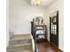 Bright entryway featuring hardwood floors, stairs, and stylish decor at 239 S Village Sq, Canton, GA 30115