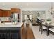 Open concept floor plan features kitchen island, dining area and sun-filled living room at 239 S Village Sq, Canton, GA 30115