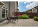 Charming outdoor patio space with a table, chairs, and lush landscaping, perfect for relaxing at 239 S Village Sq, Canton, GA 30115