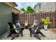 Cozy outdoor patio with chairs and pillows create an inviting backyard space at 239 S Village Sq, Canton, GA 30115