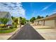 A quiet neighborhood street featuring well-maintained homes and landscaped yards on a sunny day at 239 S Village Sq, Canton, GA 30115