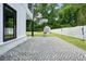 Well-maintained backyard featuring a decorative stone patio and a storage shed at 2804 Skyland Ne Dr, Brookhaven, GA 30341