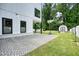 Well-maintained backyard featuring a decorative stone patio and a storage shed at 2804 Skyland Ne Dr, Brookhaven, GA 30341