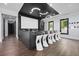 Finished basement with a large screen, wet bar, and seating for entertainment at 2804 Skyland Ne Dr, Brookhaven, GA 30341
