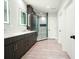 Bathroom with double vanity, tiled shower, and hardwood floors at 2804 Skyland Ne Dr, Brookhaven, GA 30341
