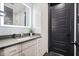 Bathroom featuring a lighted mirror over a modern vanity with a gray countertop at 2804 Skyland Ne Dr, Brookhaven, GA 30341
