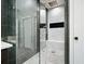 Modern bathroom features a glass-enclosed shower with elegant tile work and a built-in niche at 2804 Skyland Ne Dr, Brookhaven, GA 30341