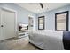 Bedroom with large windows, luxury vinyl flooring, and a television with modern fixtures at 2804 Skyland Ne Dr, Brookhaven, GA 30341