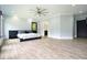 Bedroom features hardwood floors and ceiling fan at 2804 Skyland Ne Dr, Brookhaven, GA 30341