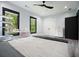 Bedroom with two bright windows, wood-look flooring, closet, and black paneled door at 2804 Skyland Ne Dr, Brookhaven, GA 30341